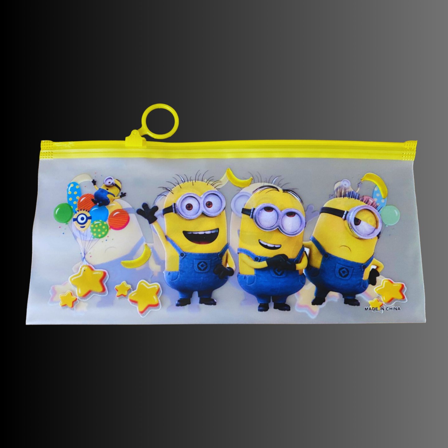 Zip pouch with a Minions print for the kit